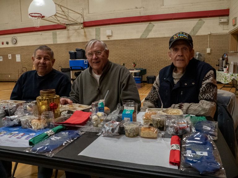 Men eating at DTE Holiday Meal