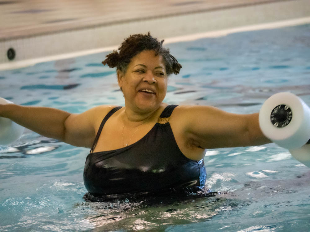 A woman swimming in an aquatics exercise class