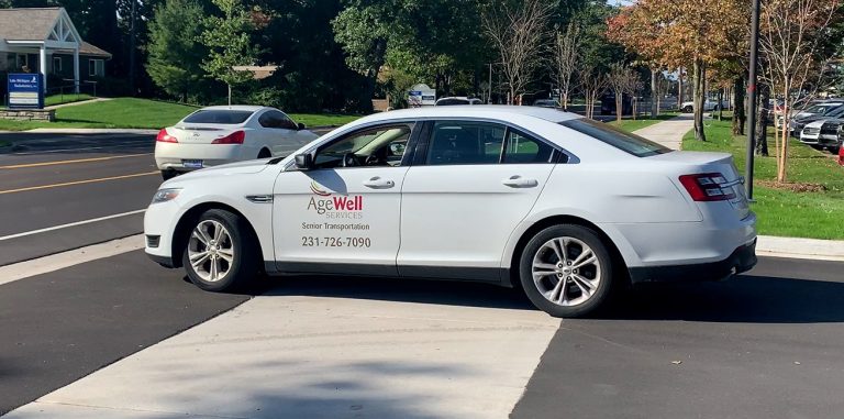 AgeWell Services Senior Transportation Car turning onto the street