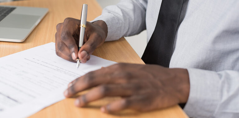 Man signing a paper