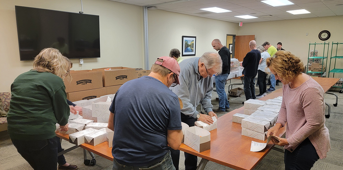 Volunteers packing emergency meals